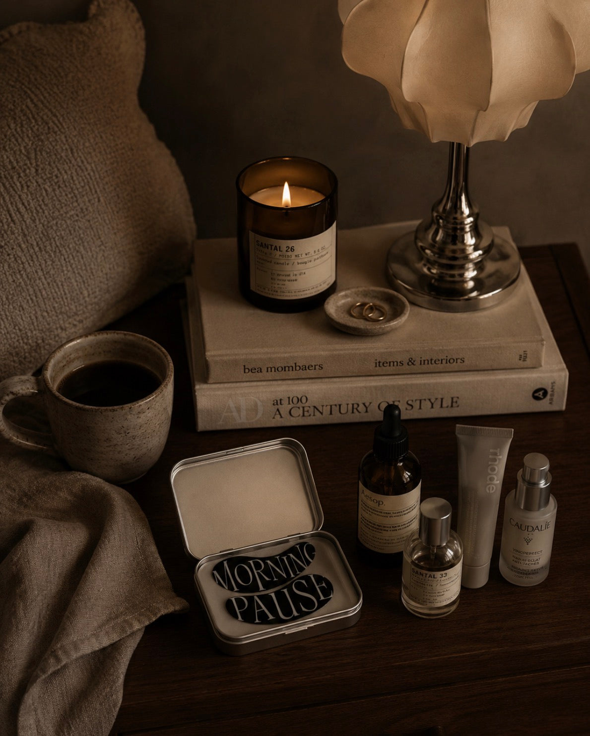 radiant every morning on night stand with coffee and candle