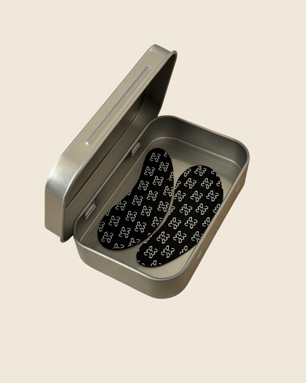 every morning eye patches in an open metal tin
